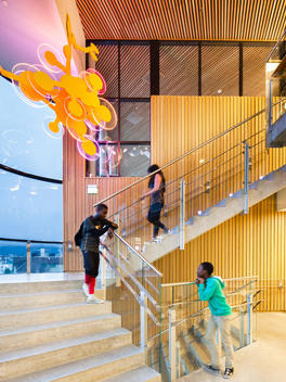 Students on stairs in Ny-Krohnborg School, designed by Cubus / Ramboll, Bergen, Norway.