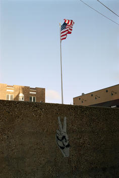 American Flag With Spraypainted Peace Symbol