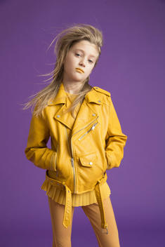 girl in yellow on purple background