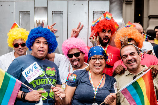 Costumed supporters pose as they watch the 2015 NYC Pride March (Gay Pride Parade).