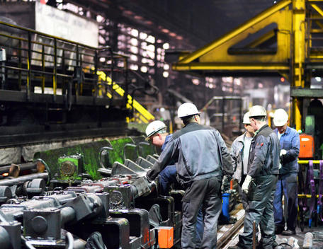 Workers doing maintenance works in a tube rolling mill