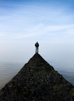 Man on a path at the sea