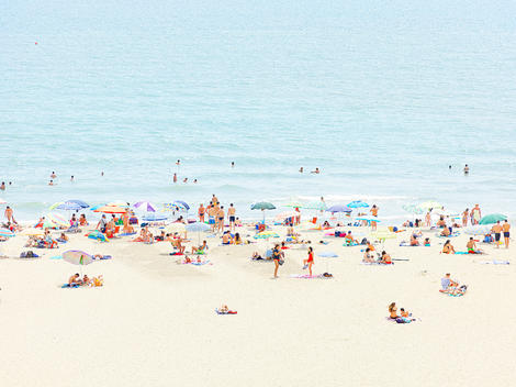 aerial view of beach scenery with many umbrellas