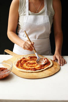 A Woman Preparing Pizza