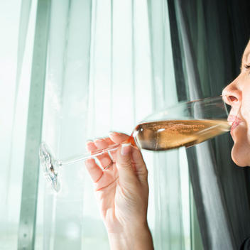 woman drinks champagne at The World - Luxury Residence at Sea