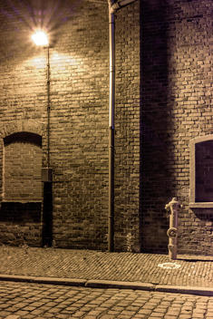 Germany, Bremen, A hydrant and a street lamp in an abandoned industrial district