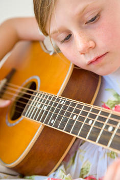 Young Girl Playing Guitar