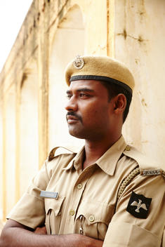 A portrait of an Indian police officer.