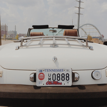 Back of vintage white car with Tennessee license plate