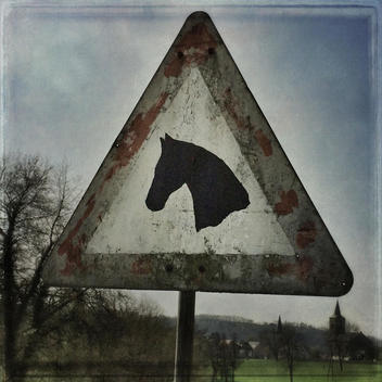 Weathered road sign with horse head, Duesseldorf, Wuelfrath, Germany