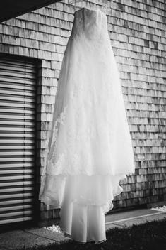 white dress in lace hanging on hangers