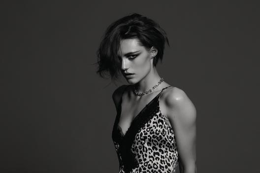 Model in short hair and leopard printed top