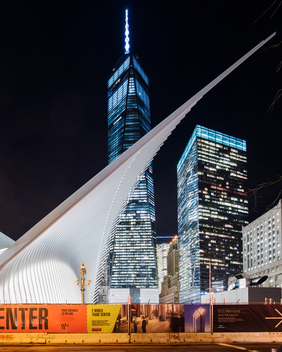 Transportation Hub in illuminated in the background designed by Santiago Calatrava. World Trade Center