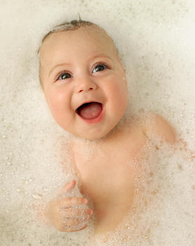 Baby Girl Smiling In Bubble Bath