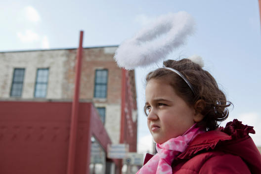 A Young Girl Wears A Halo Headband For Halloween In Chicago.
