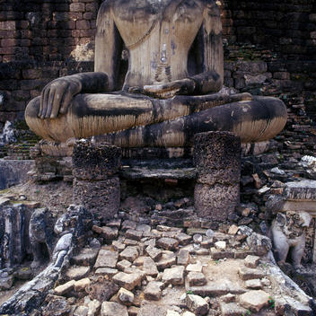 Base Of Stone Buddha Statue In Ruins In Thailand