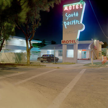 Neon Motel Sign On The Corner Of A Street In Miami, Florida, Usa.