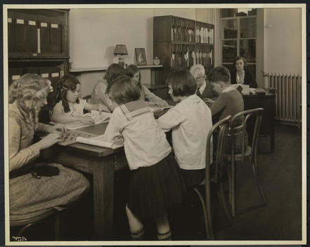 Blind Children Seated At A Table Reading Braille Music And Playing Checkers In The Music Waiting Room At The New York Association For The Blind, 111 East 59Th Street.