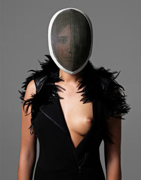 Portrait Of A Woman Posing In A Fencing Mask