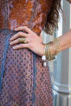 detail of jewelry and bracelets on jewelry designer Liseanne Frankfurt's hand