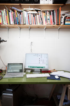 Laptop And Computer On Desk With Books, New York, Usa.