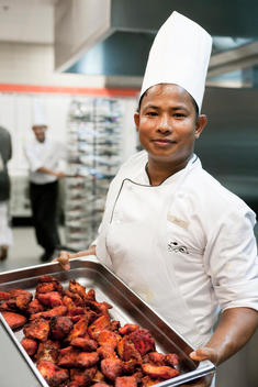 Chef Displaying Tray Of Chicken Wings