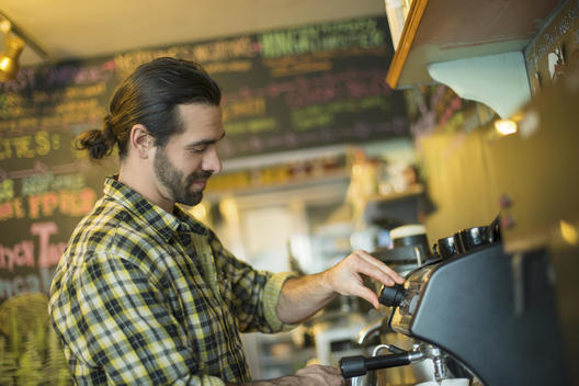 A coffee shop and cafe in High Falls called The Last Bite. A man making coffee.