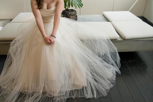 A Bride To Be Waits In A New York City Dress Store