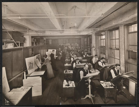 Interior Of Mccall Co.\'S Pattern Design Room Mostly Men, And Some Women Sketching Clothing Designs At Rows Of Artist\'S Tables.