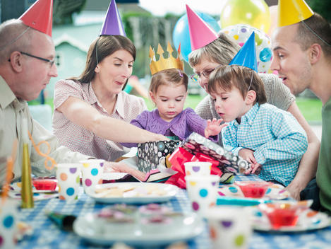 Girl with family at birthday party