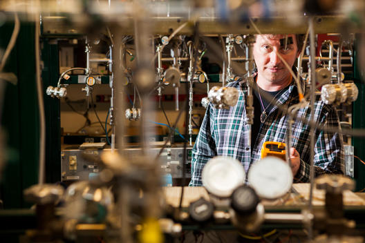 A man takes measurements at a radiocarbon laboratory in Boulder, Colorado.