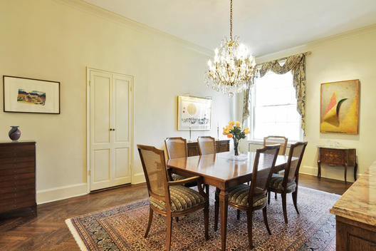 Spare Dining Room With Chandelier And Antiques