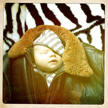 Baby sleeping in Leather Jacket