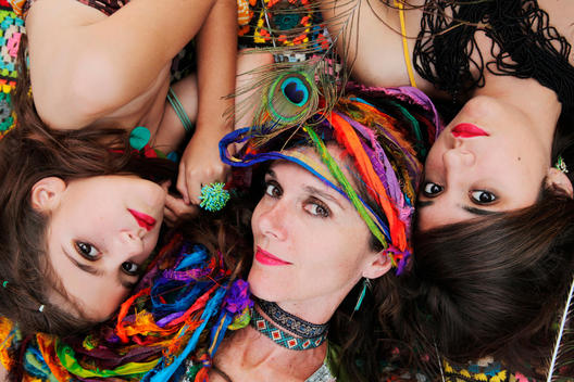 Mother and daughters wearing colorful jewelry