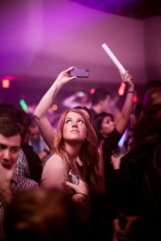 Young party crowd inside a nightclub