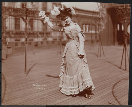 An Actress In Costume Rehearsing On The Roof Of What Is Probably The New York Theatre.