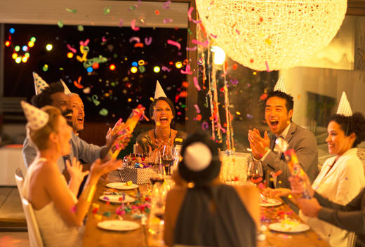 Friends throwing confetti at birthday party
