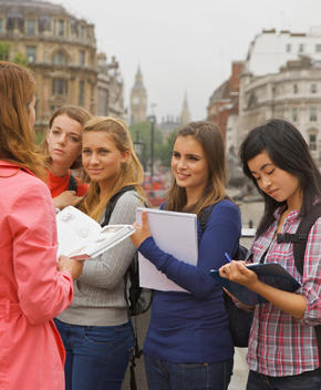 Back View of Woman Standing in front of Teenage Girls