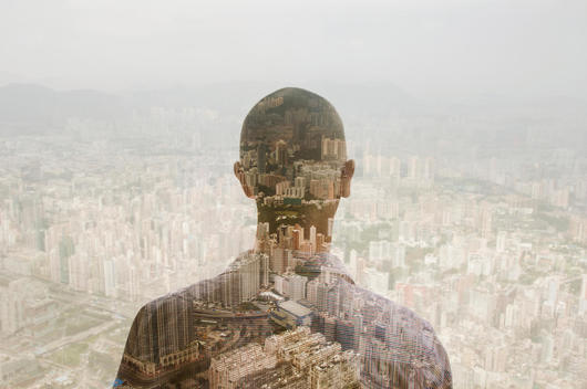 Businessman and Hong Kong cityscape, composite image