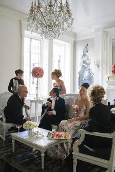 fashion designer Zang Toi and guests in the living room of his upper east side apartment before a dinner party