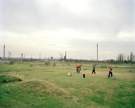 Chechen Children Playing In Fields Outside The Tanzila Idp Refugee Settlement. The Families Living Here Fled To This Region Of Ingushetia From Grozny During The War In Chechnya In Early 2000.