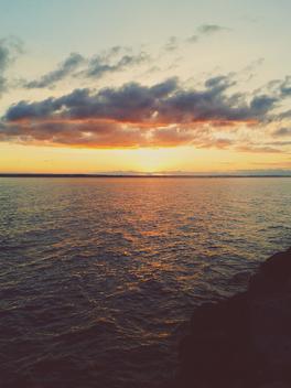 Sweden, Smaland, Graenna, sunset over the port of Graenna
