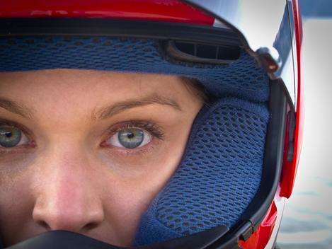 Close-up of woman wearing sports helmet