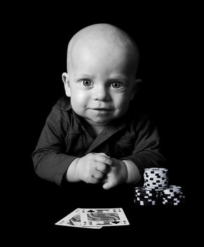 Portrait Of A Baby With Cards And Gambling Chips.