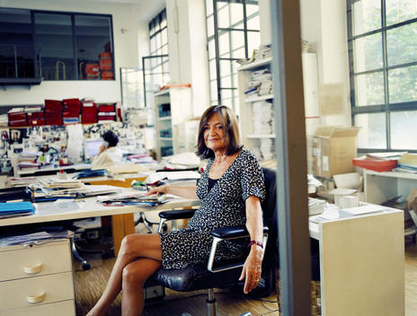 Grazia Neri Sitting And Smiling In Old Office In Milan, Italy.