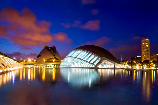 Spain, Valencia, view to lighted L\'Hemisferic and Palau de les Arts Reina Sofia at City of Arts and Sciences