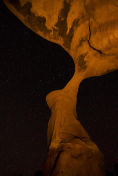 Light-painted desert arch and stars