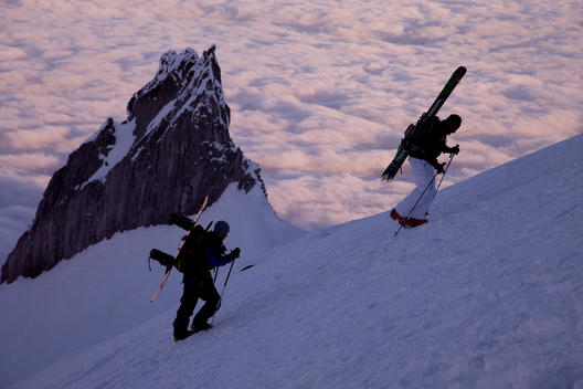 Two skiers enjoy a early spring climb on Mt Hood.