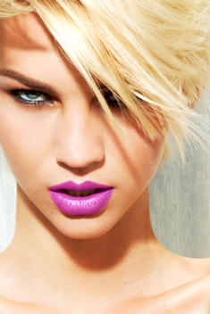 Studio beauty cropped portrait of a caucasian blond female model white background, bight light, bright makeup