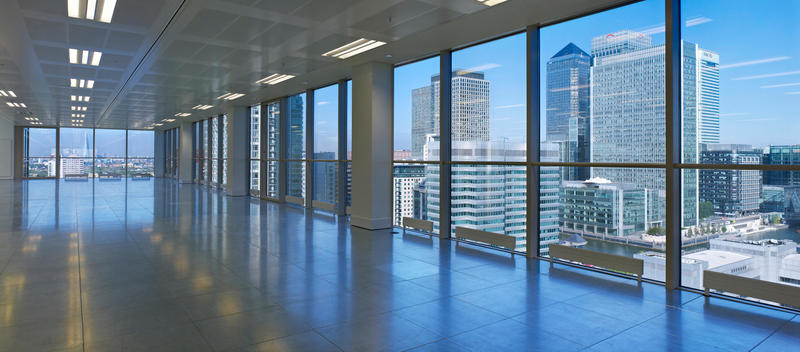 Empty office space with view of city from Exchange Tower, Docklands, London, England, UK